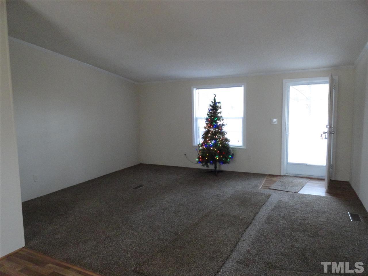 3388 Dirgie Mine Road Roxboro, NC 27574 - Photo 5 of 12 an empty room with a window