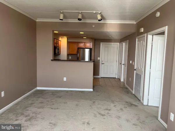 an empty room with window and closet