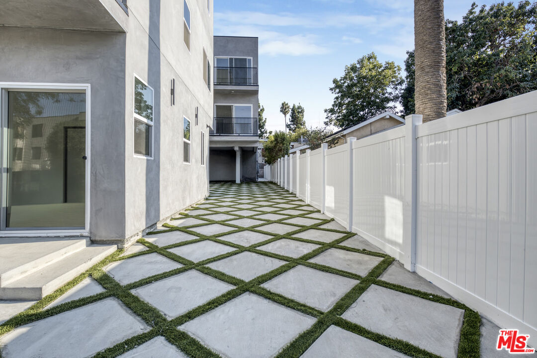 10826 3/4 Hesby Street North Hollywood, CA 91601 - Photo 3 of 26 a view of a backyard with sitting area