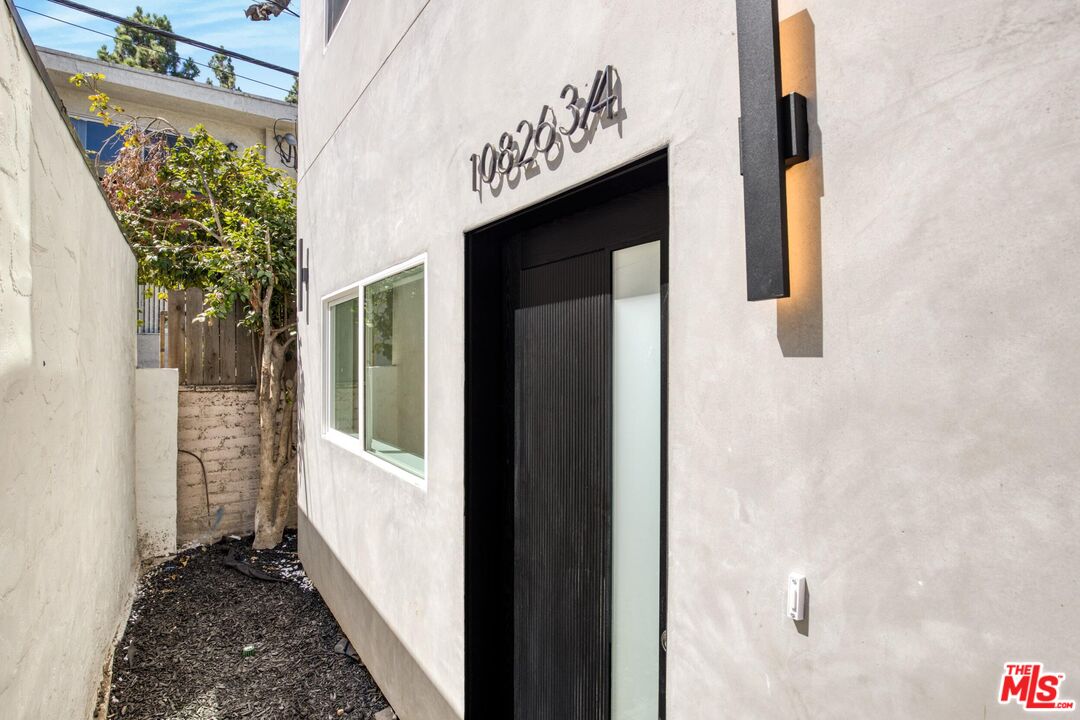 10826 3/4 Hesby Street North Hollywood, CA 91601 - Photo 4 of 26 a view of a door and an outdoor space