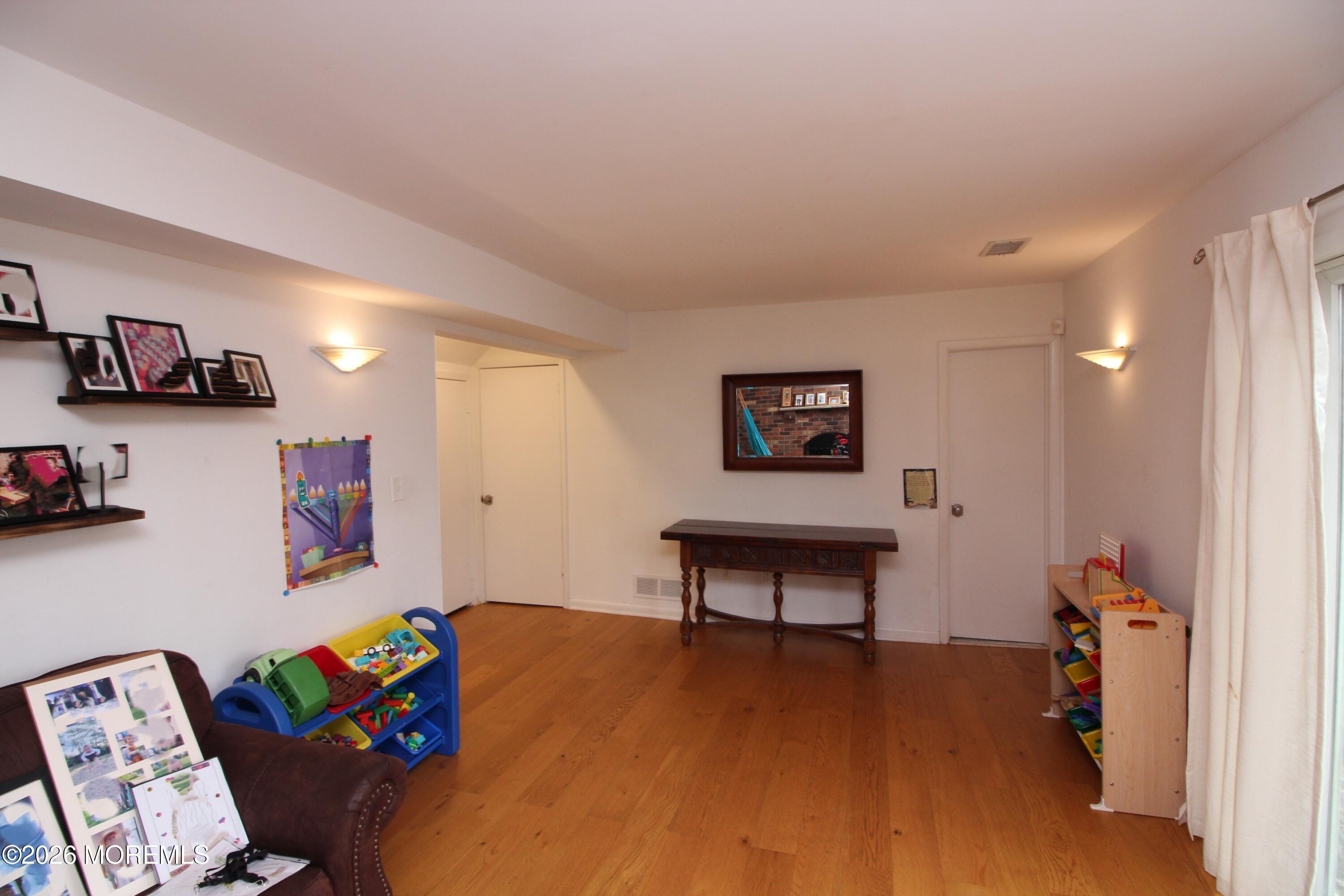 7 Portsmouth Road Englishtown, NJ 07726 - Photo 23 of 29 a living room with furniture and a wooden floor