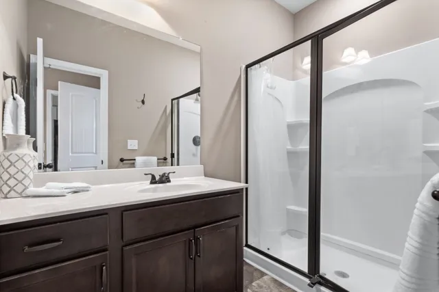 a bathroom with a double vanity sink mirror and double