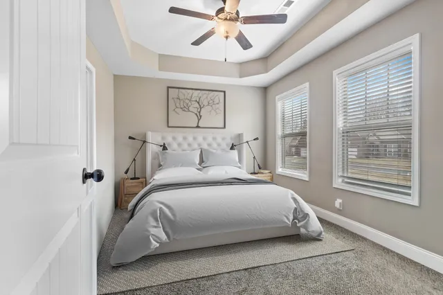 a bedroom with a bed and window