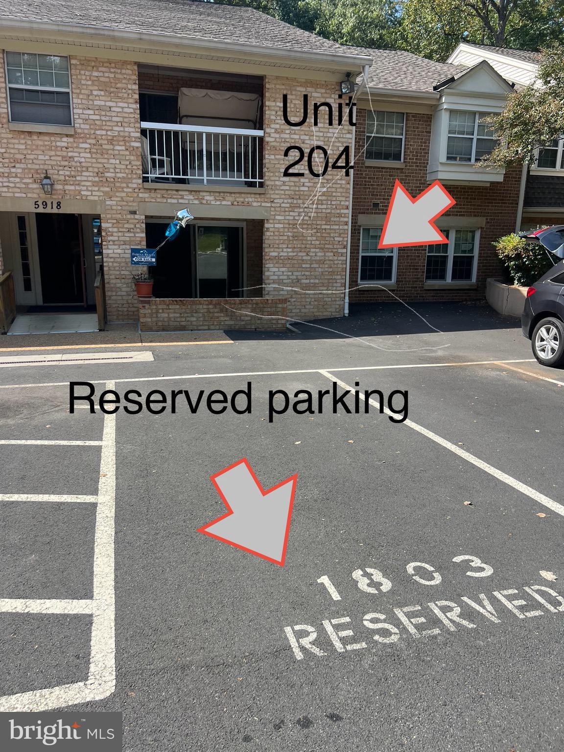 a front view of a house with parking