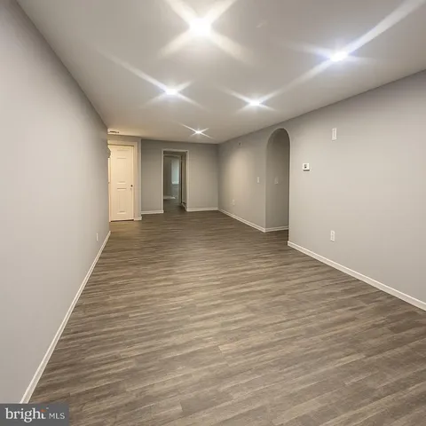 a kitchen with a sink a stove and cabinets