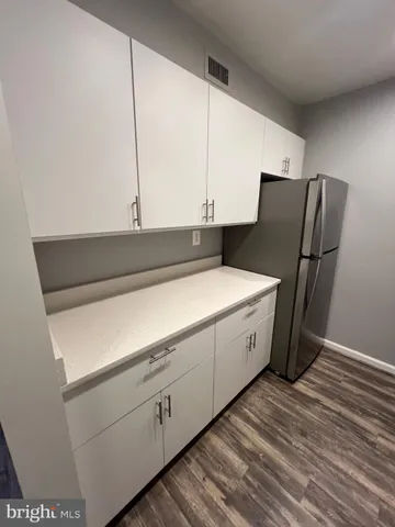 a bathroom with a shower and a sink