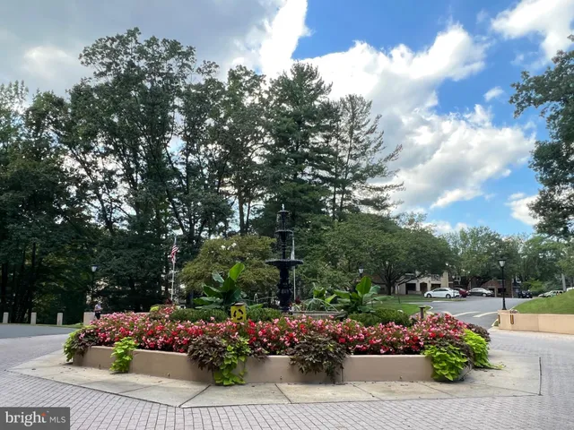 a view of a house with a yard and porch