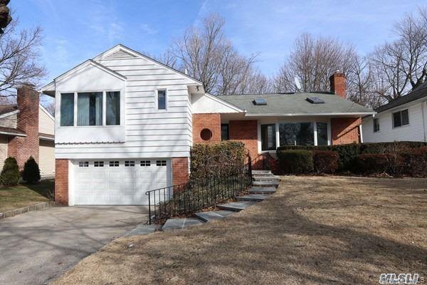 5 Gilbert Road Great Neck, NY 11024 - Photo 20 of 20 a front view of a house with a yard