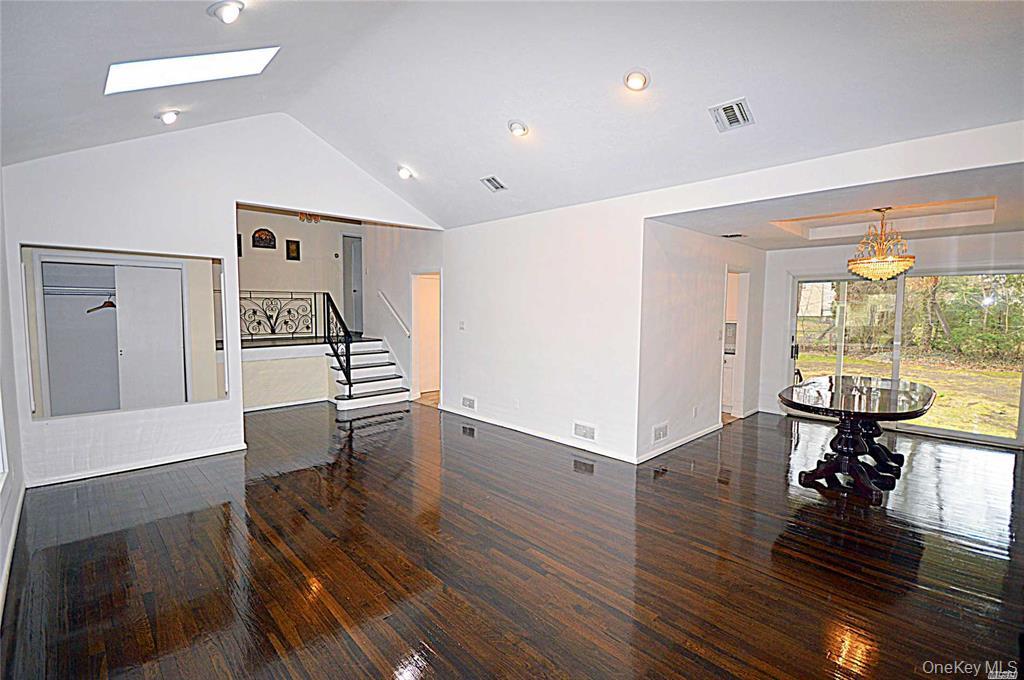 5 Gilbert Road Great Neck, NY 11024 - Photo 2 of 20 a living room with furniture and a wooden floor