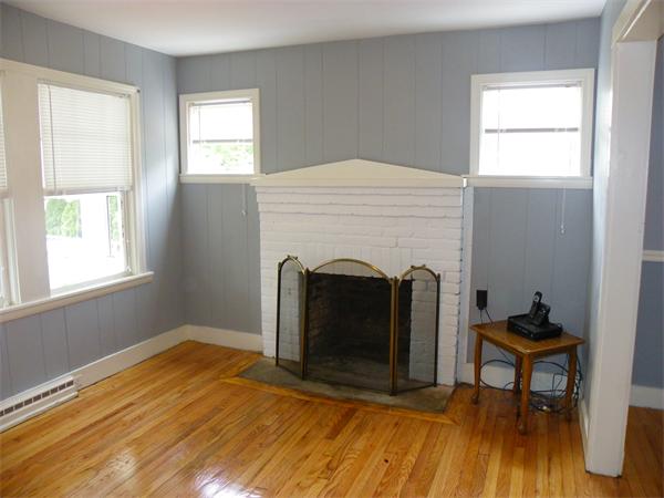137 Edgehill Road Braintree, MA 02184 - Photo 3 of 11 a view of a livingroom with furniture and a fireplace