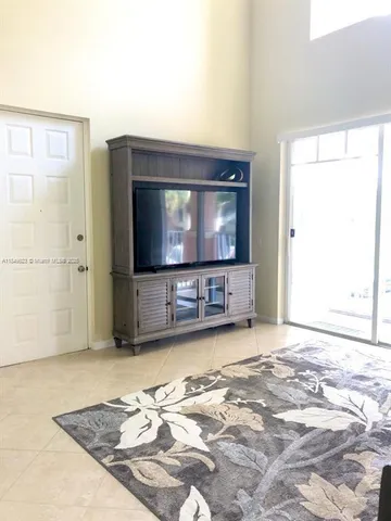a living room with a couch and a flat screen tv