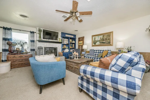 a bedroom with furniture and a chandelier