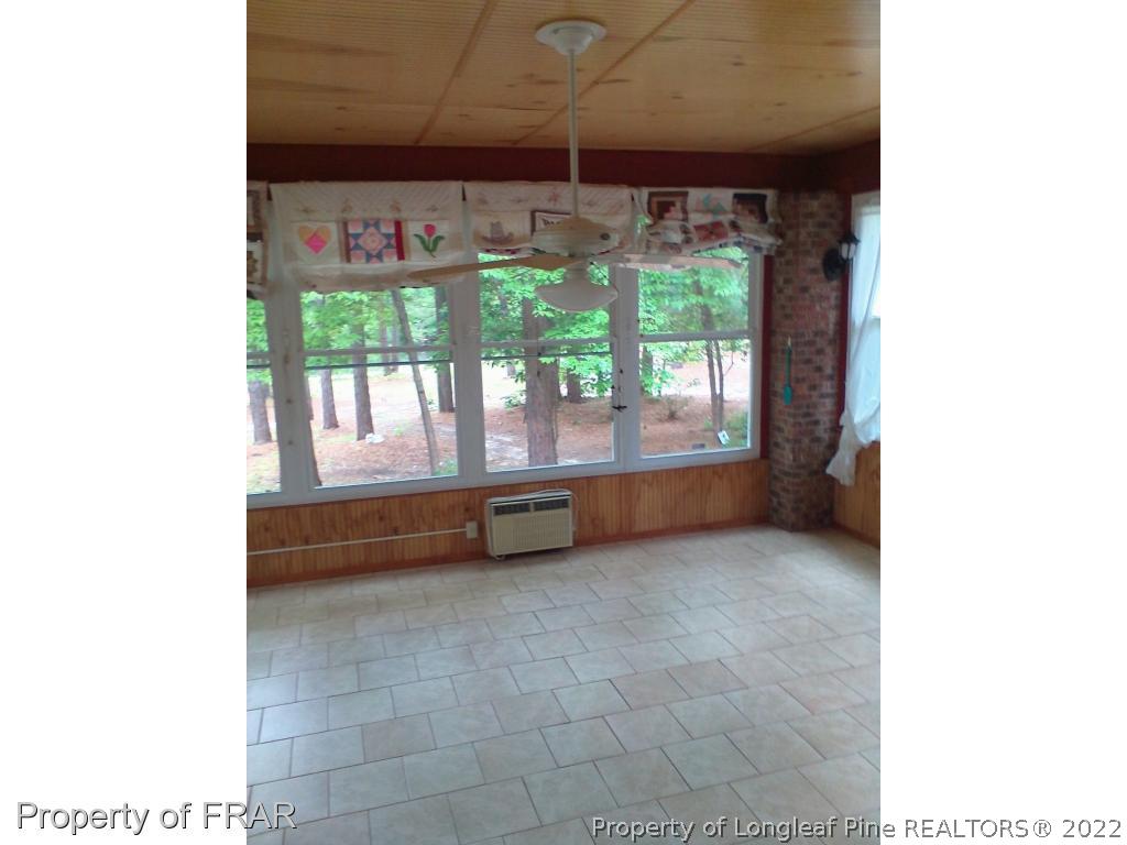 1305 Myra Road Rockfish, NC 28376 - Photo 10 of 17 a view of room with furniture and a porch