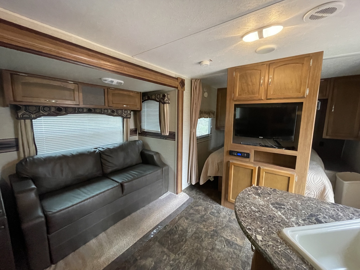 12-13 Woodhaven Lakes Sublette, IL 61367 - Photo 11 of 26 a living room with a flat screen tv and a couch