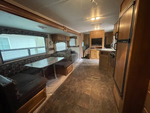 a lobby with furniture and a table