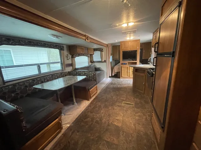 a lobby with furniture and a table