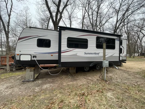 a view of a car park in front of the house