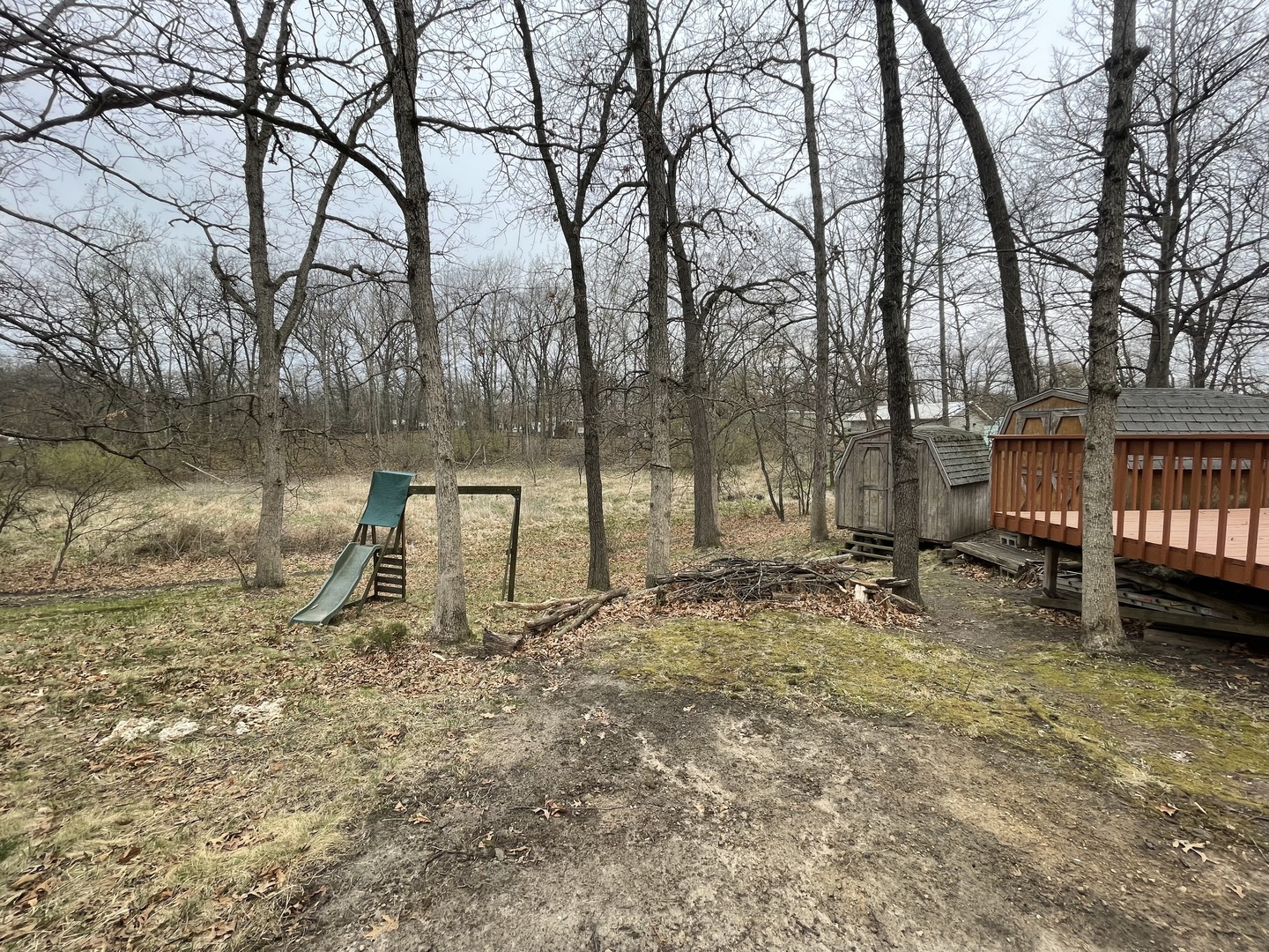 12-13 Woodhaven Lakes Sublette, IL 61367 - Photo 25 of 26 a backyard of a house with lots of green space and fountain