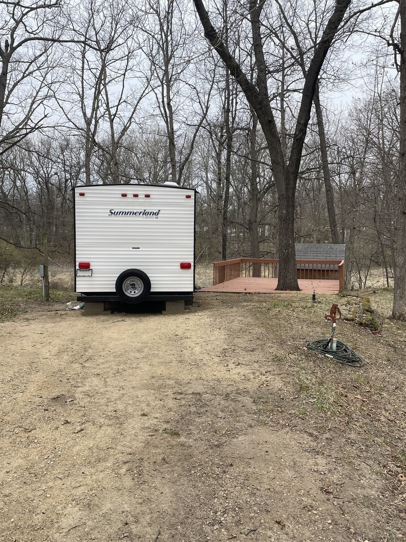 12-13 Woodhaven Lakes Sublette, IL 61367 - Photo 26 of 26 a car parked in front of a house