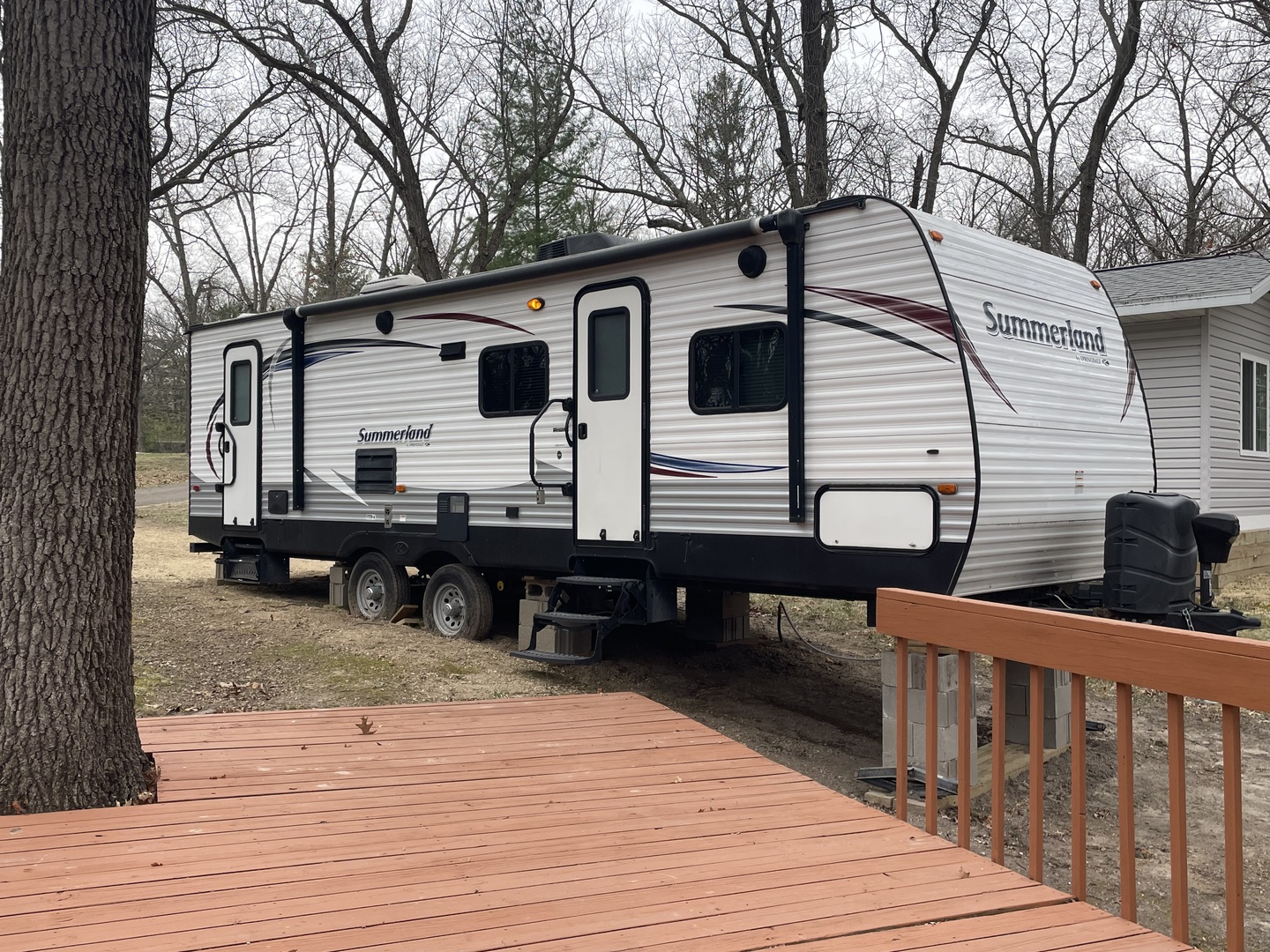12-13 Woodhaven Lakes Sublette, IL 61367 - Photo 5 of 26 a view of a house with wooden deck and furniture