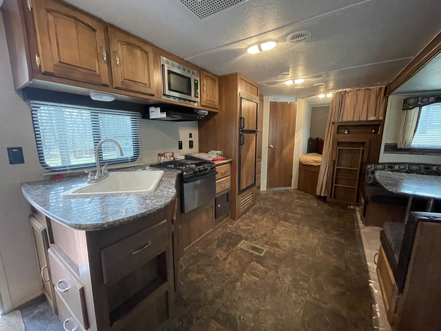 12-13 Woodhaven Lakes Sublette, IL 61367 - Photo 10 of 26 a kitchen with stainless steel appliances granite countertop a sink stove and refrigerator