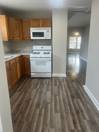 a kitchen with a sink and a stove top oven