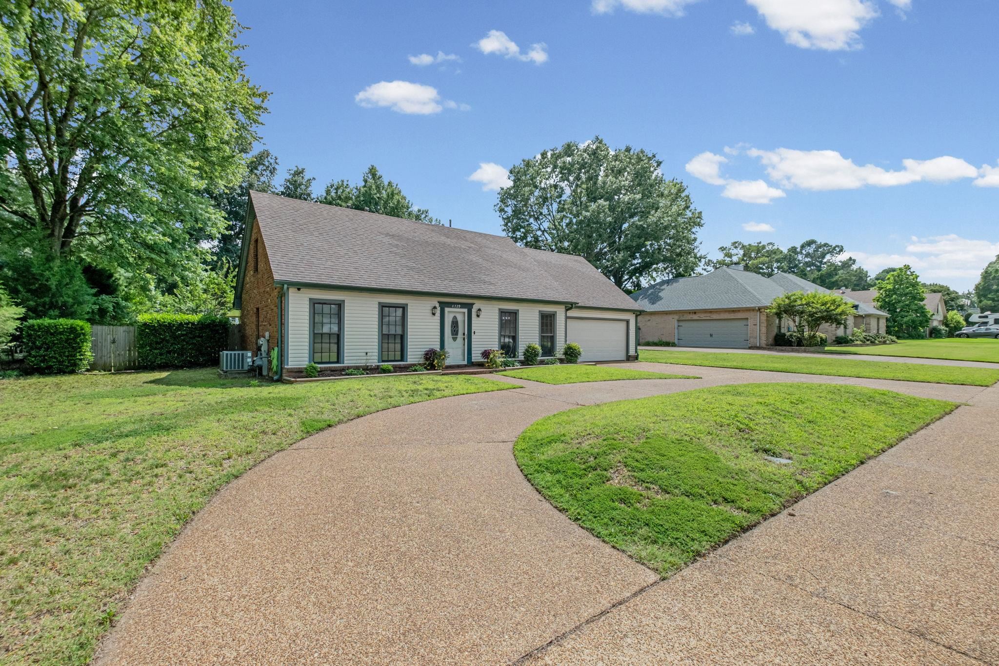 4729 Cedar Ridge Drive Millington, TN 38053 - Photo 2 of 40 Traditional-style residence with light-colored siding and a dark-toned roof