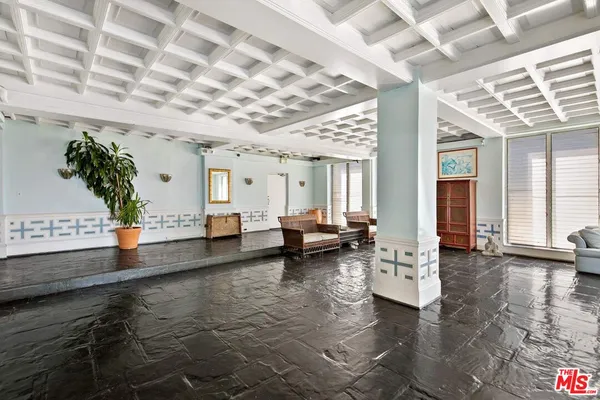 a view of a dining room with furniture and a chandelier