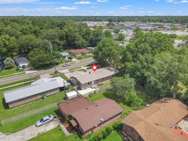 an aerial view of a house with a garden