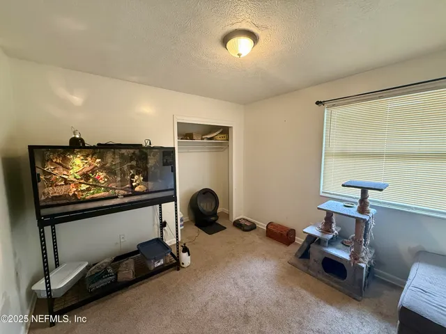 a room with furniture projector and screen