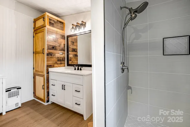 a view of workspace filled with furniture and wooden floor
