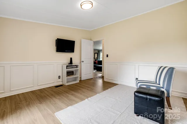 a view of a wooden deck next to a yard