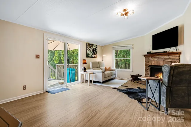 a bedroom with furniture fireplace and flat screen tv