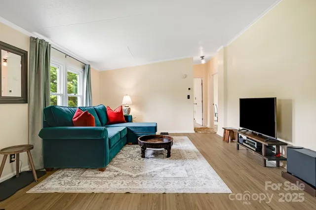 a bathroom with a sink mirror and shower