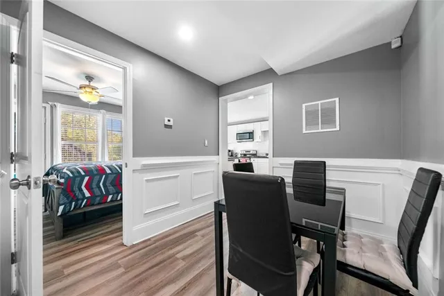 a livingroom with furniture and a stove