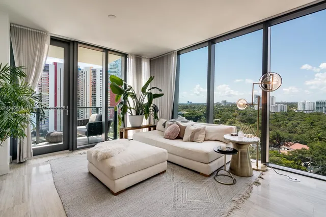 a living room with couch and a large window