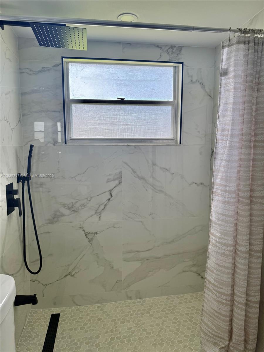 150 Southwest 134th Way, Unit 305R Pembroke Pines, FL 33027 - Photo 11 of 19 a bathroom with a shower