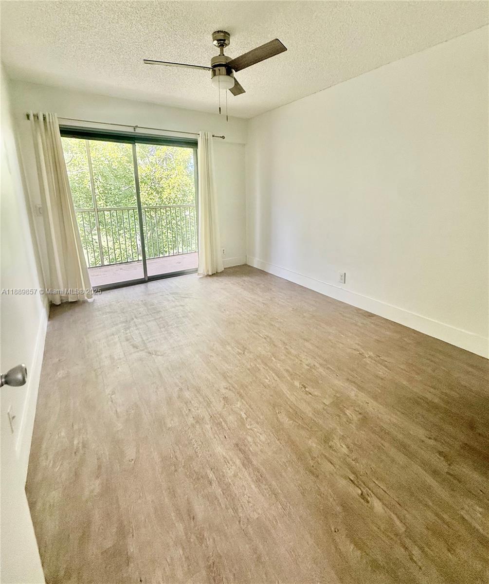 150 Southwest 134th Way, Unit 305R Pembroke Pines, FL 33027 - Photo 13 of 19 a view of an empty room with a window