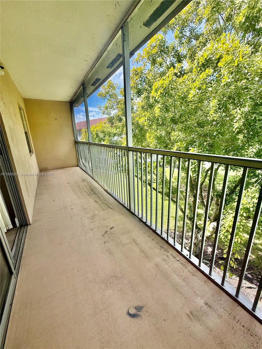 150 Southwest 134th Way, Unit 305R Pembroke Pines, FL 33027 - Photo 16 of 19 a view of balcony with wooden floor