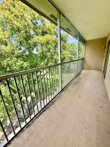 a view of a house with backyard garden and sitting area