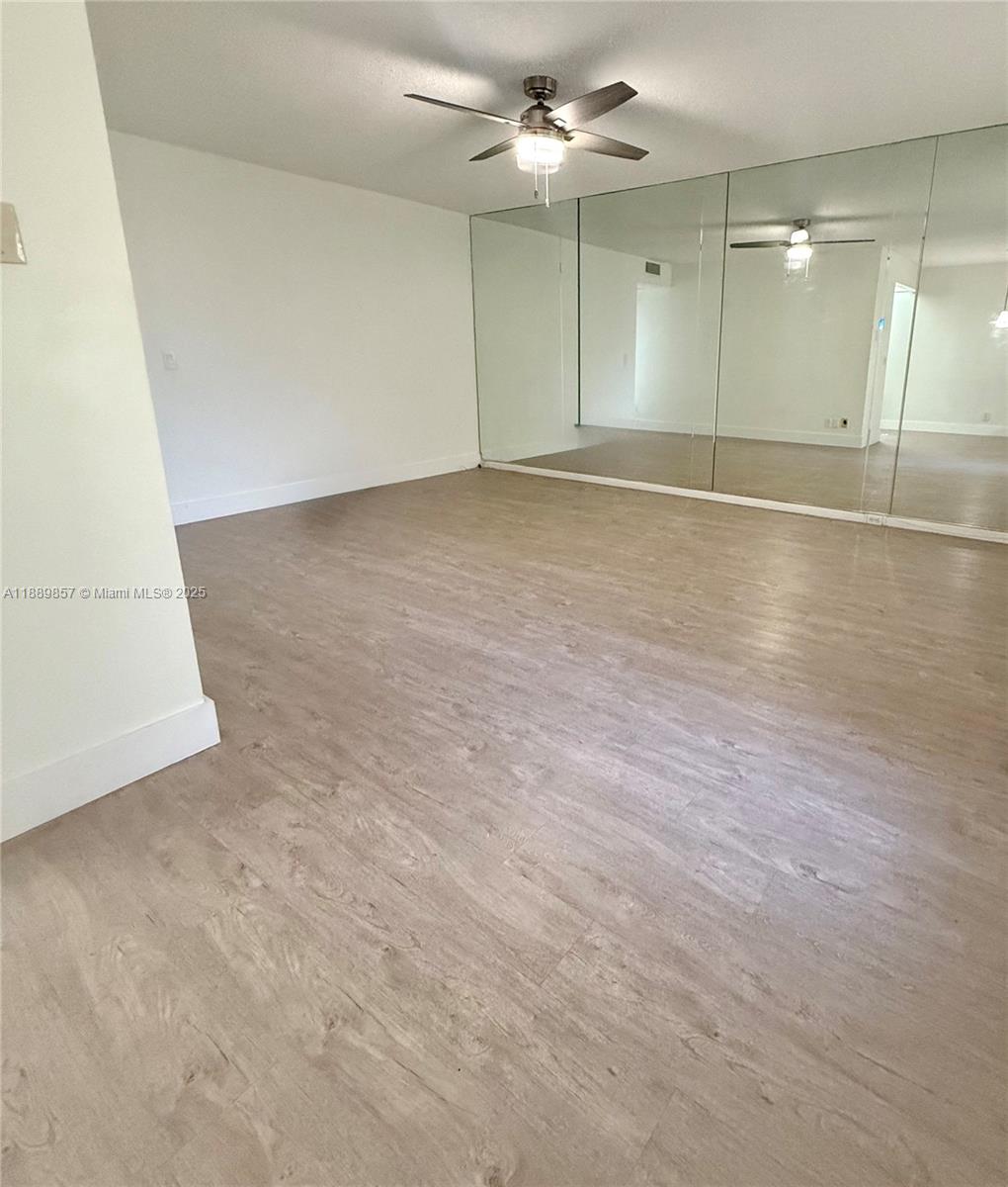 150 Southwest 134th Way, Unit 305R Pembroke Pines, FL 33027 - Photo 2 of 19 an empty room with fan and a ceiling fan