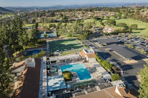 an aerial view of residential houses with outdoor space