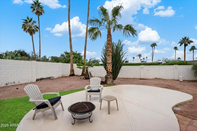 a view of a backyard with a patio