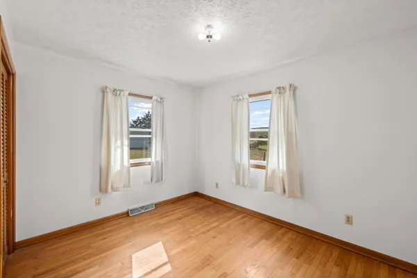 a view of balcony with wooden floor
