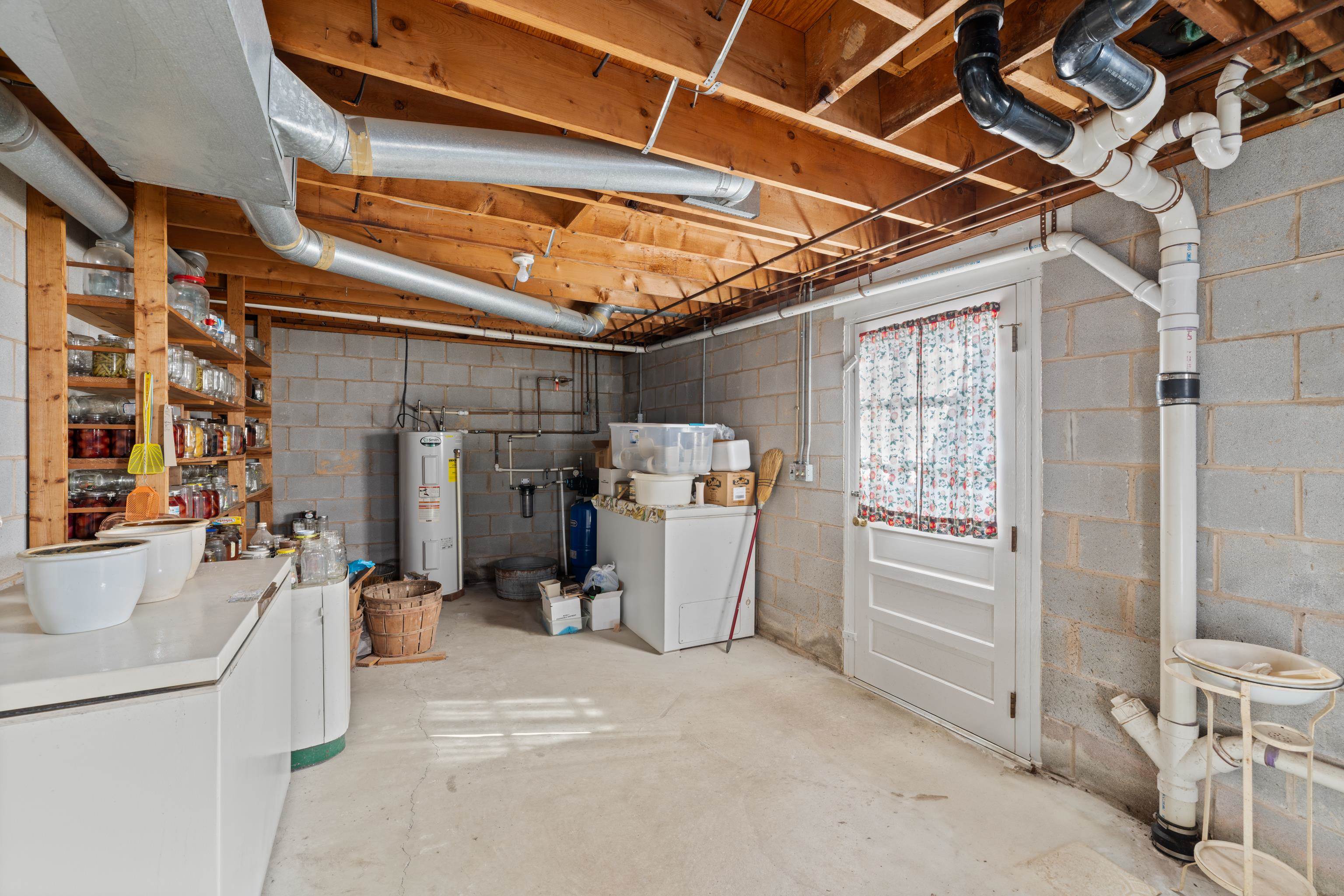 3493 Zion Church Road Broadway, VA 22815 - Photo 30 of 74 a view of a storage & utility room with closet dryer and washer