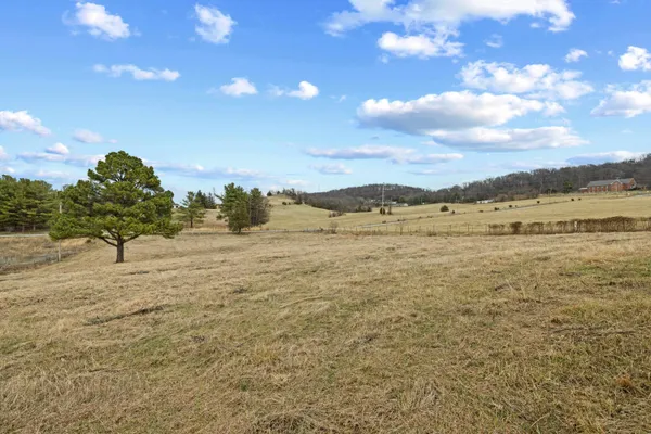 an aerial view of a houses with a yard