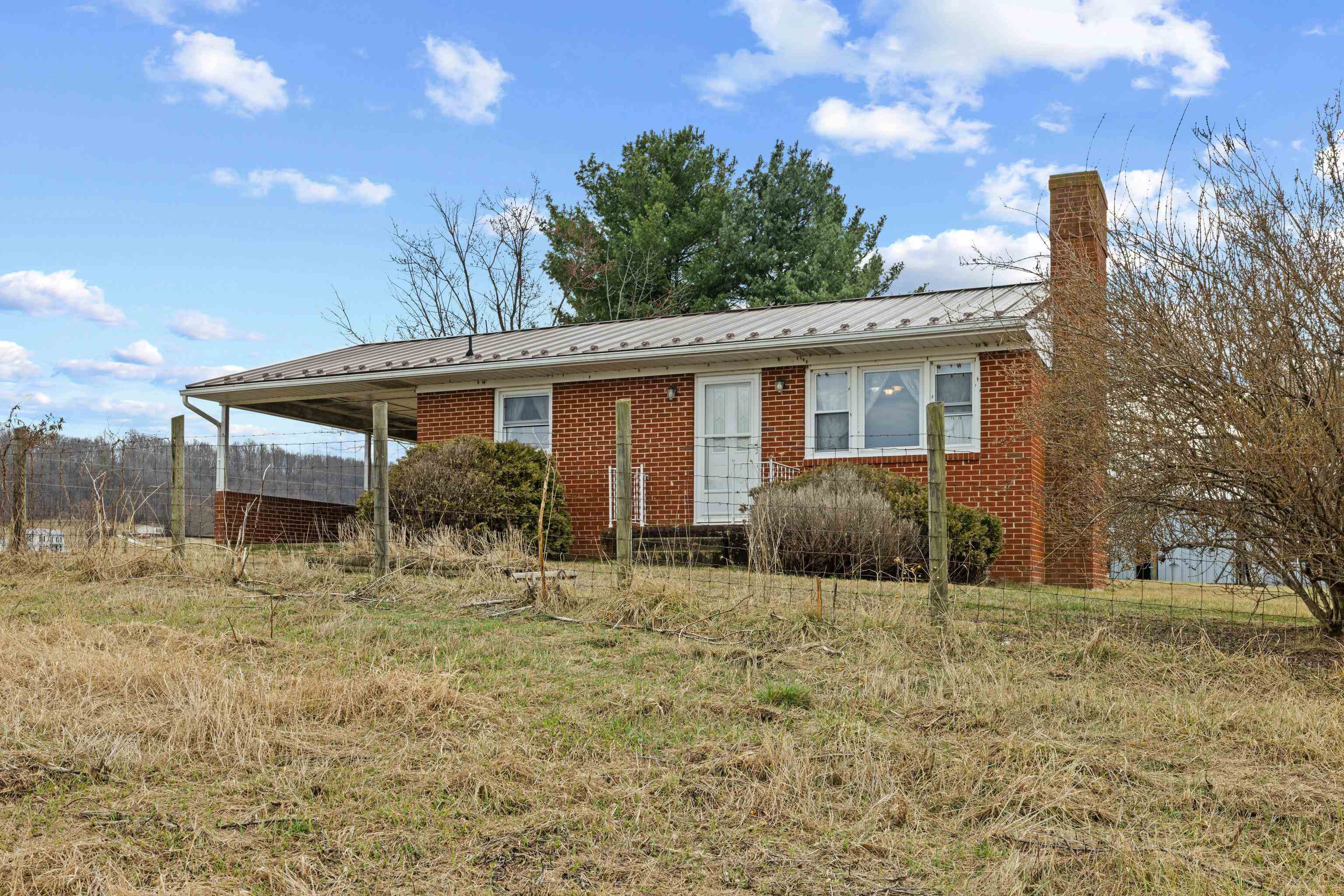 3493 Zion Church Road Broadway, VA 22815 - Photo 5 of 74 a backyard of a house with table and chairs