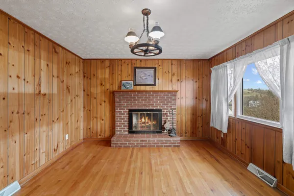 a view of fireplace with wooden floor