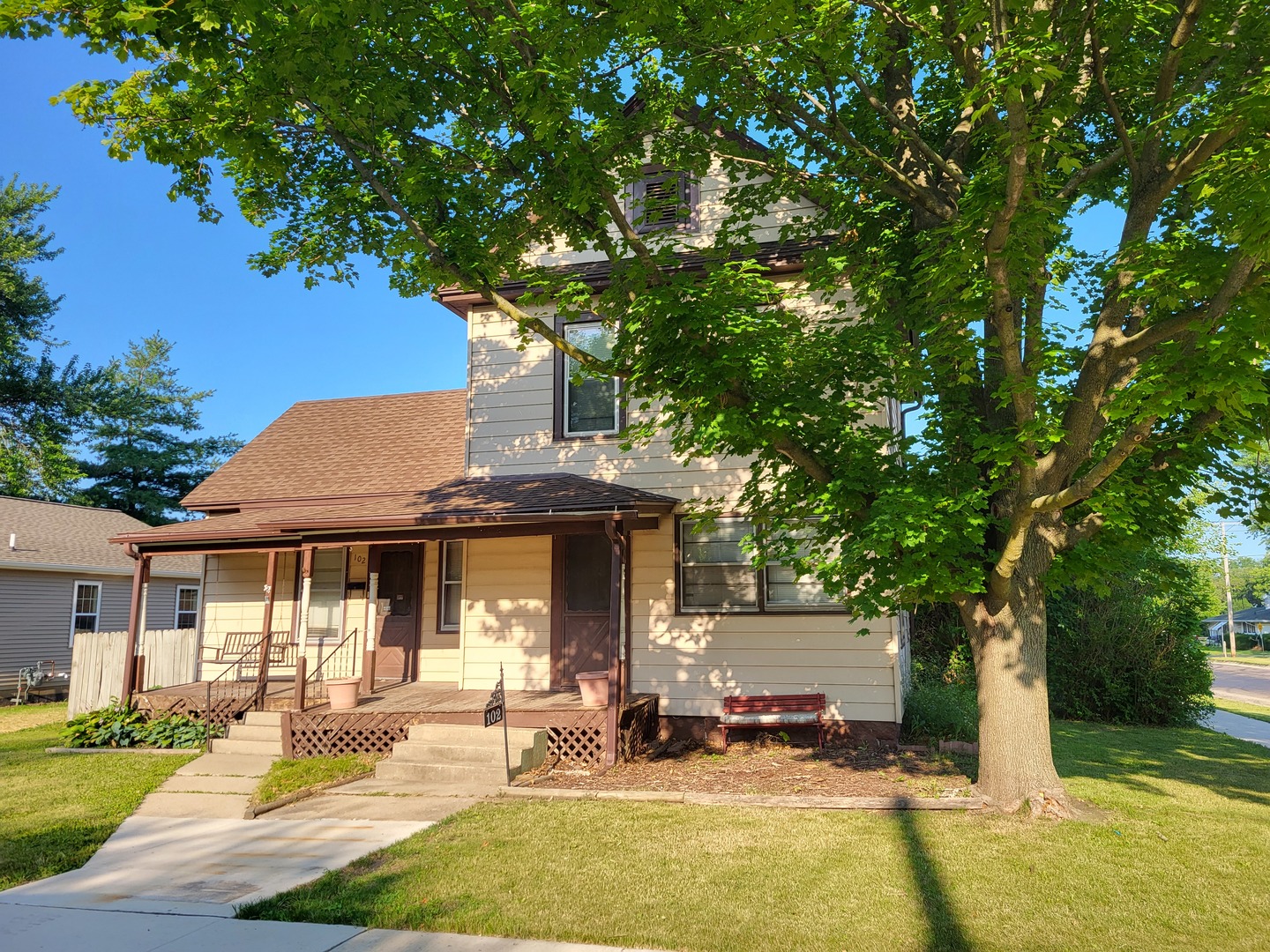 102 South 9th Street Rochelle, IL 61068 - Photo 1 of 13 a front view of a house with garden and patio