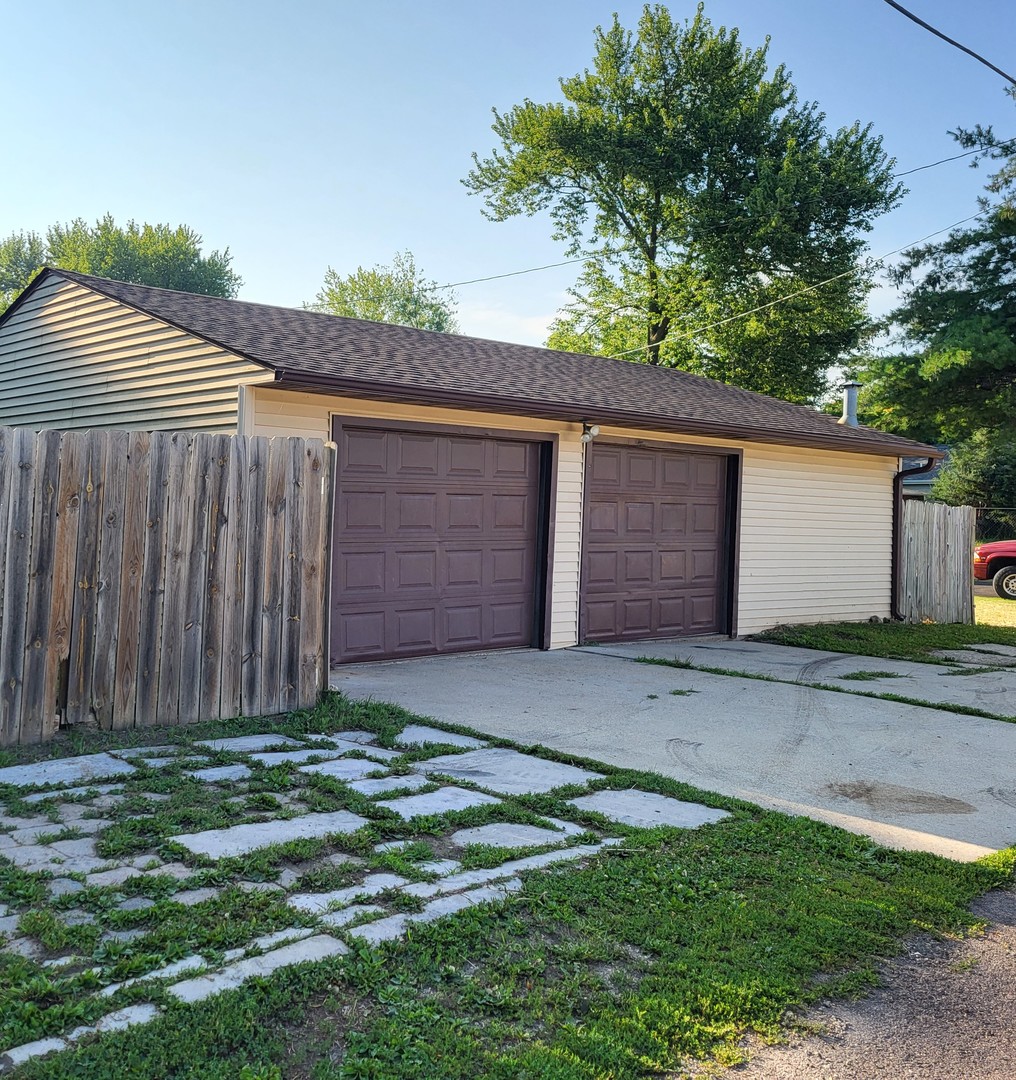 102 South 9th Street Rochelle, IL 61068 - Photo 2 of 13 a front view of house with backyard